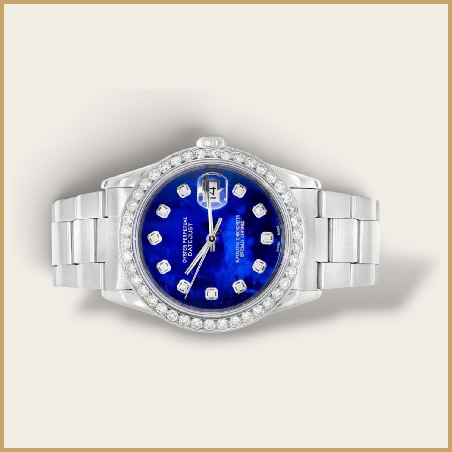 Silver Datejust watch with a blue dial and a diamond bezel