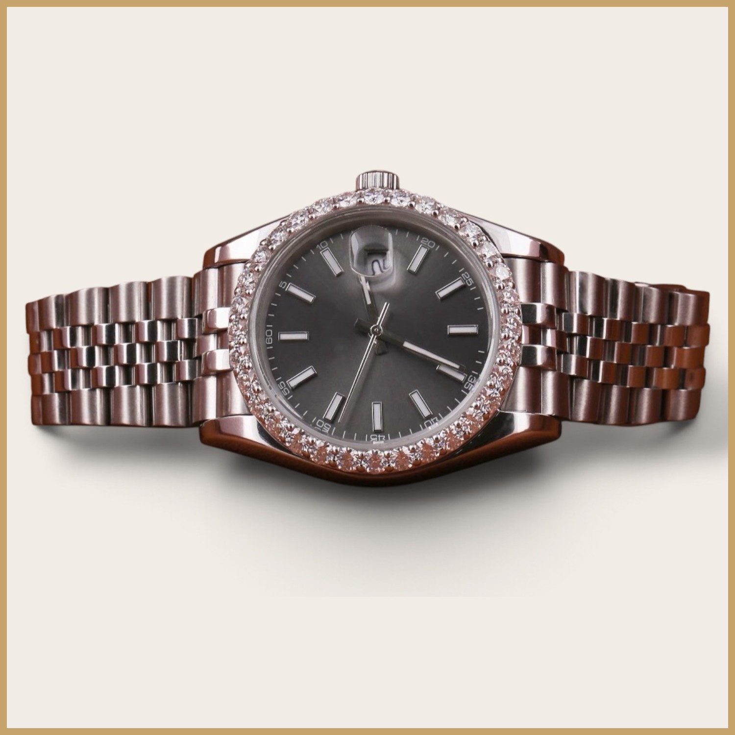 Rose gold tone watch with a gray dial and a diamond bezel