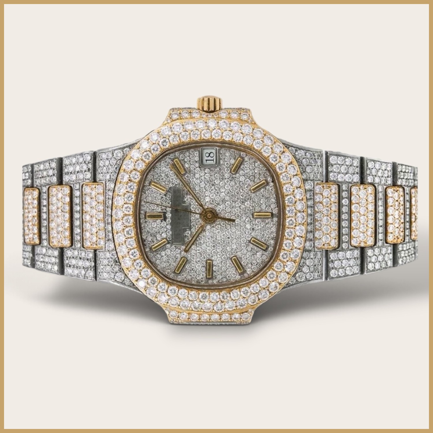 Two-tone watch with gold stick markers on a pavé dial