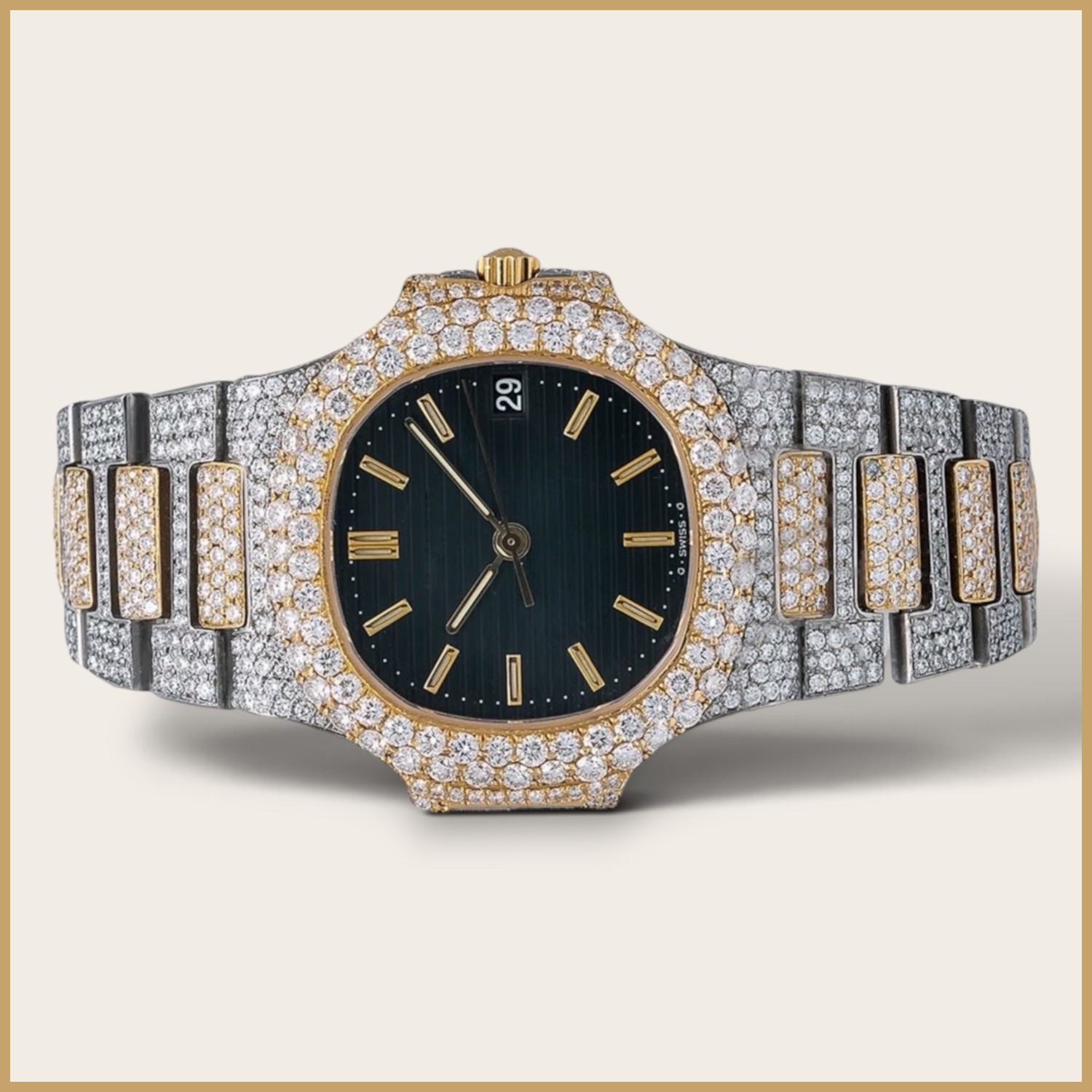 Two-tone watch with a green dial and gold stick markers
