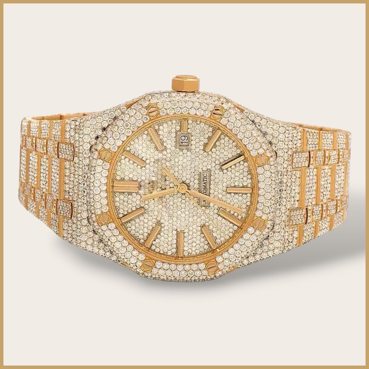 Gold tone automatic watch with a pavé dial